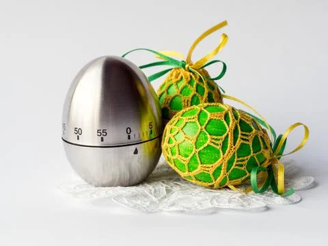 Egg timer and easter eggs Stock Photos