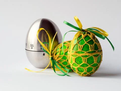 Egg timer and easter eggs Stock Photos