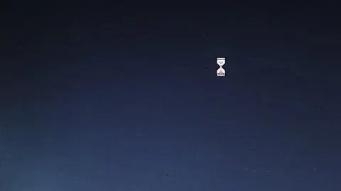 Egg timer and mouse cursor icons appear on blue pc screen interface Stock Footage 312021070