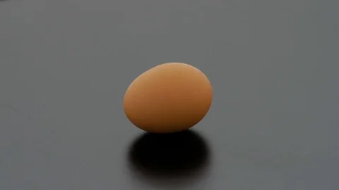 Egg on Turntable - Black Background Stock Footage 75752899