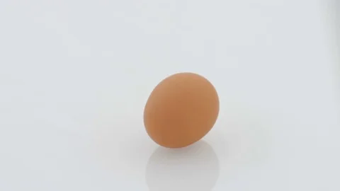 Egg on Turntable - White Background Stock Footage 75752578