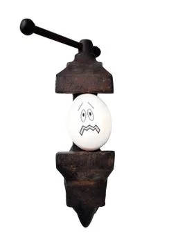 Egg in vise Stock Photos