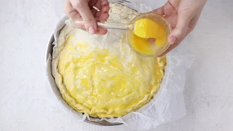Egg wash on a pie Stock Footage