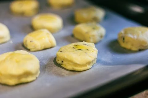 The egg wash process before baking handmade English scones Fotos Stock