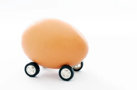 Egg on wheels Stock Photos