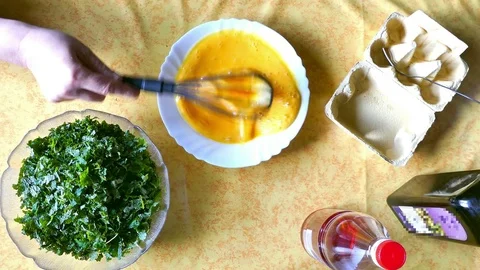 Egg whisking on the kitchen table. Top view. Stock Footage 74356433