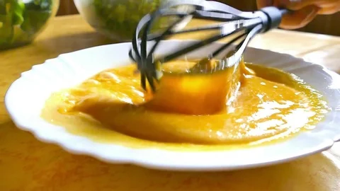 Egg whisking with whisker in the kitchen. Stock Footage 74349984