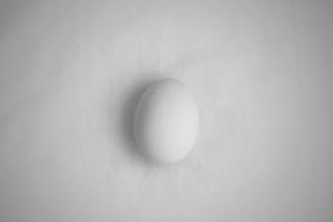 Egg on white cloth flat lay Stock Photos