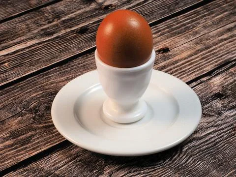 Egg in a white egg stand Stock Photos