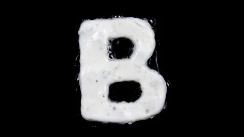 Egg white frying letter B, include two looped 10 seconds duration versions Stock Footage 130799034