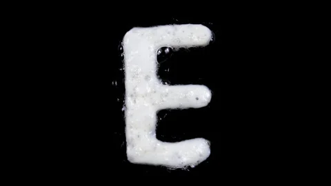 Egg white frying letter E, include two looped 10 seconds duration versions Stock Footage 130799805