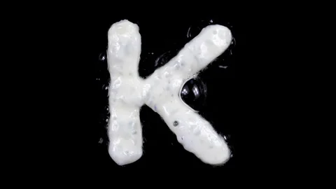 Egg white frying letter K, include two looped 10 seconds duration versions Stock Footage 130800866