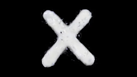 Egg white frying letter X, include two looped 10 seconds duration versions Stock Footage 130803035