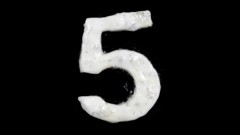 Egg white frying number five, 5, two looped 10 seconds duration versions Stock Footage 130903631