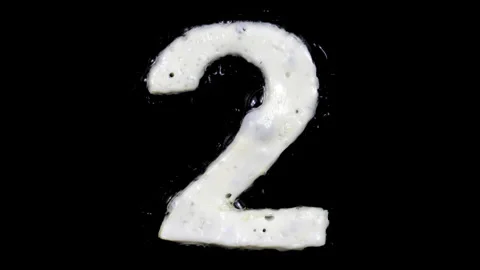 Egg white frying number two, 2, two looped 10 seconds duration versions Stock Footage 130900314