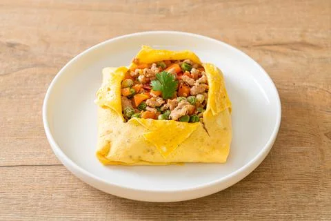 Egg wrap or stuffed egg with minced pork and vegetable Stock Photos