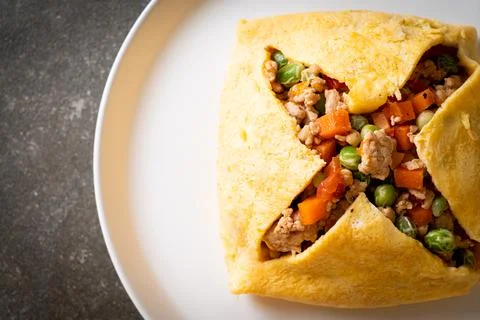 Egg wrap or stuffed egg with minced pork and vegetable Stock Photos