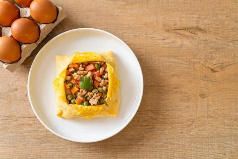 Egg wrap or stuffed egg with minced pork and vegetable Stock Photos