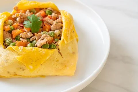 Egg wrap or stuffed egg with minced pork and vegetable Stock Photos
