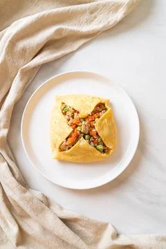 Egg wrap or stuffed egg with minced pork and vegetable Stock Photos