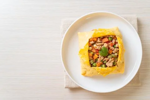 Egg wrap or stuffed egg with minced pork and vegetable Stock Photos