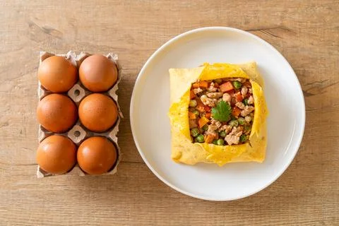 Egg wrap or stuffed egg with minced pork and vegetable Stock Photos