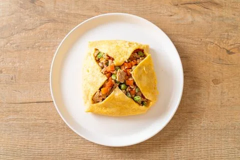 Egg wrap or stuffed egg with minced pork and vegetable Stock Photos