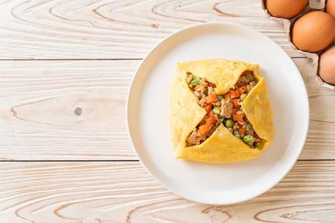 Egg wrap or stuffed egg with minced pork and vegetable Stock Photos
