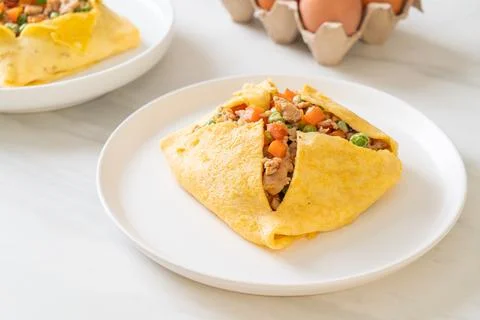 Egg wrap or stuffed egg with minced pork and vegetable Stock Photos
