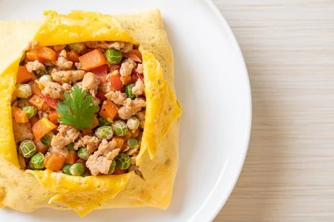 Egg wrap or stuffed egg with minced pork and vegetable Stock Photos
