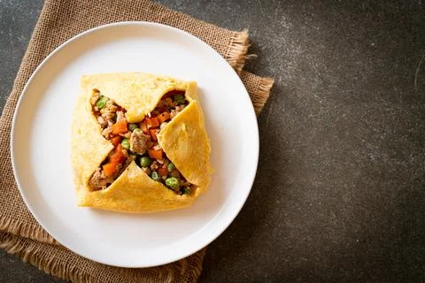 Egg wrap or stuffed egg with minced pork and vegetable Stock Photos
