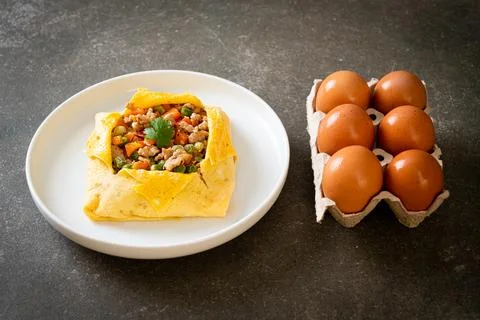 Egg wrap or stuffed egg with minced pork and vegetable Stock Photos