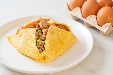 Egg wrap or stuffed egg with minced pork and vegetable Stock Photos