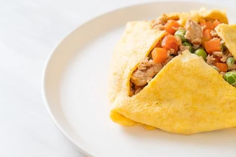 Egg wrap or stuffed egg with minced pork and vegetable Stock Photos