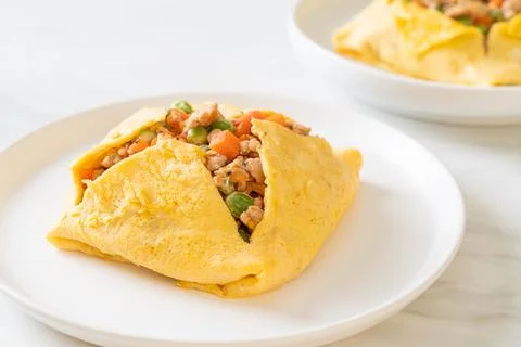 Egg wrap or stuffed egg with minced pork and vegetable Stock Photos