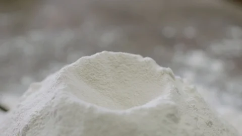 Egg Yolk is Dropping into The Dough Stock Footage 115863030