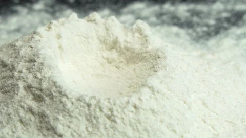 Egg Yolk Falling on Flour Stock Footage 122740854