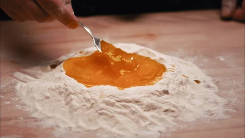 Egg Yolk Mixing by hand Stock Footage 254934260