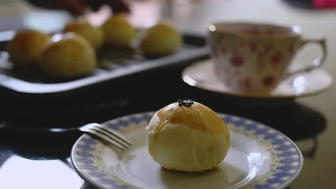 Egg Yolk Pastries Served with Hot Tea for Mid Autumn Festival Stock Footage 345669468