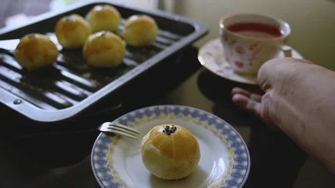 Egg Yolk Pastries Served with Hot Tea for Mid Autumn Festival Stock Footage 345669516