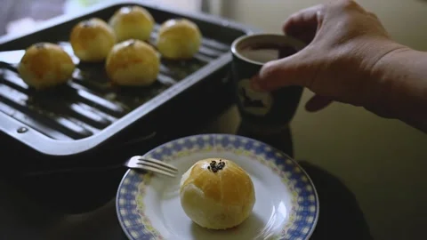 Egg Yolk Pastries Served with Hot Tea for Mid Autumn Festival Stock Footage 345669535