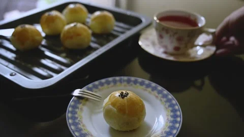 Egg Yolk Pastries Served with Hot Tea for Mid Autumn Festival Stock Footage 345669548