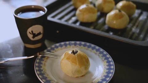Egg Yolk Pastries Served with Hot Tea for Mid Autumn Festival Stock Footage 345669600