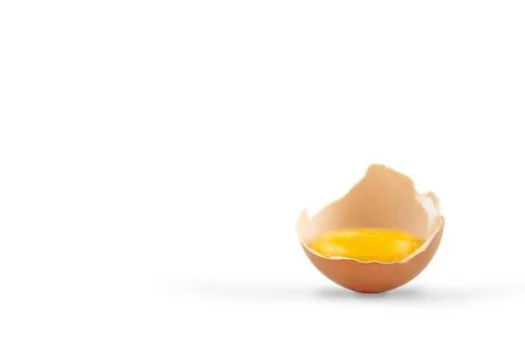 Egg yolk in the shell on a white background. Copy space. Fotos de archivo