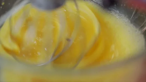 Egg Yolks are Stirred by Kitchenmachine Closeup Stock Footage 99162742
