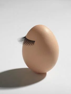 Egg_with_eyelashes Stock Photos