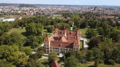 Eggenberg Palace with the city of Graz in the background on a sunny afternoon Stock Footage 344639545