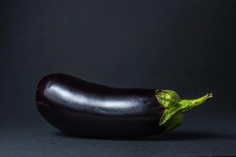 Eggplant on a black background. Stock Photos