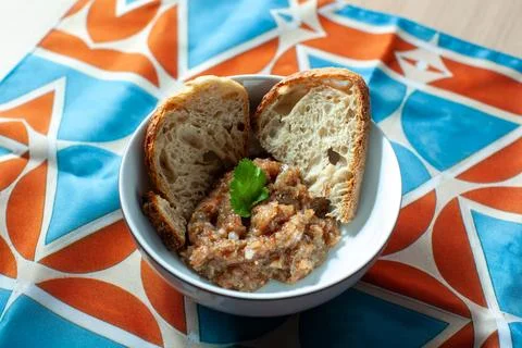 Eggplant caviar with two slices of bread and coriander leaf Foto stock