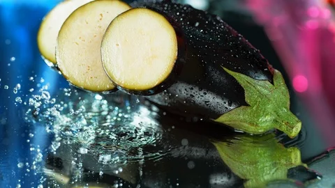 Eggplant, close-up,Aubergine falling down in water, super slow motion video, 4k Stock Footage 114964068